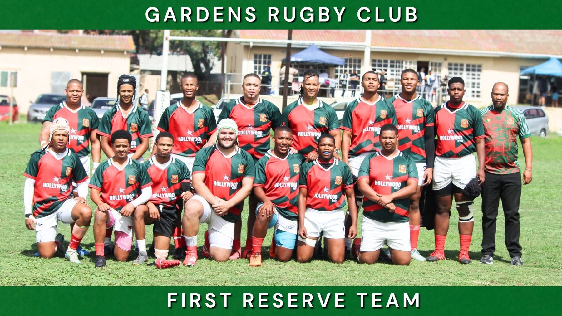 Gardens first reserve team in red jerseys, posed on the field